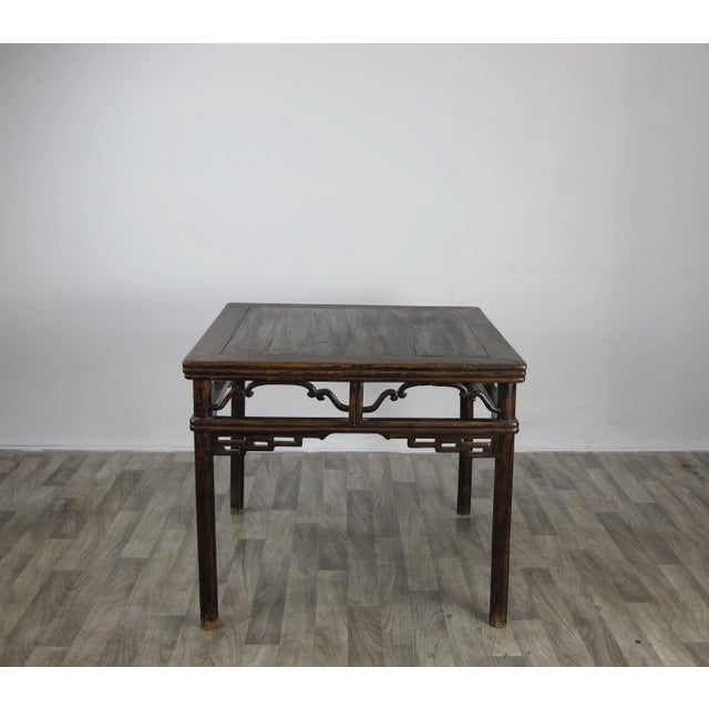 This 37" inch square table from late 19 century showcases marvelous fretwork around all 4 sides. smooth round legs and top...
