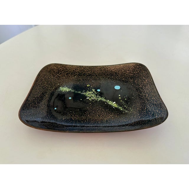 Copper plate by San Francisco artist Win Ng, circa .1960s USA. A beautiful enameled catchall, the dish features a...