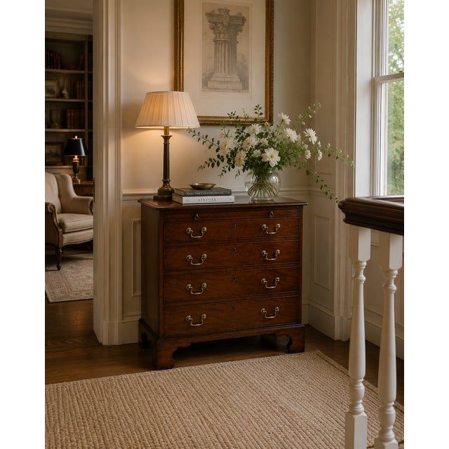 This superb antique small Georgian mahogany four drawer chest of drawers with brushing slide dates from around 1780 and is...
