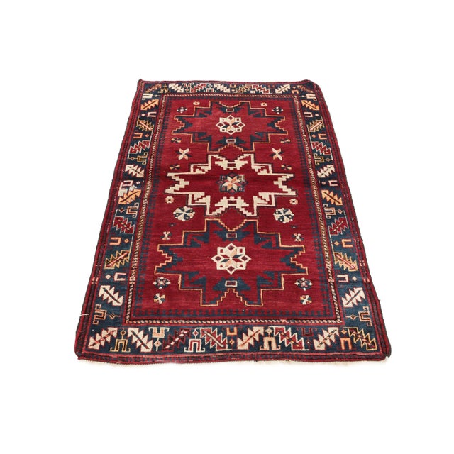 Decorative handknotted vintage wool Caucasian rug. Approximately 65-75 years old. In very good condition.