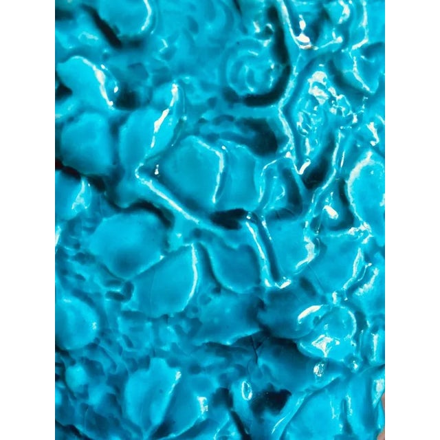 Rare, exquisite, art nouveau vase with floral detail on the body with sinewy vines at the base, made by a member of the...