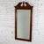Marvelous vintage Chippendale style wall mirror composed of a walnut toned wood rectangular frame with an arched and...