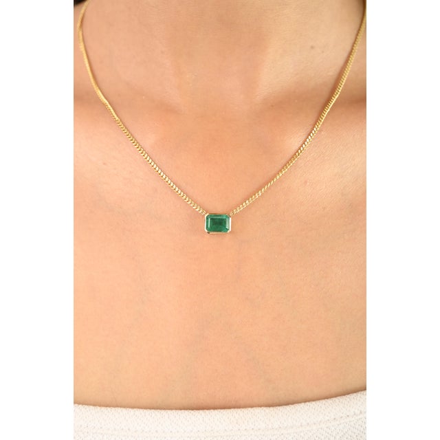 Elevate your fine jewelry collection with this 14K yellow gold Zambian emerald solitaire necklace—a stunning piece that...