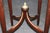 This elegant French Louis XVI style bronze-mounted occasional table, dating from the late 19th to the early 20th century,...