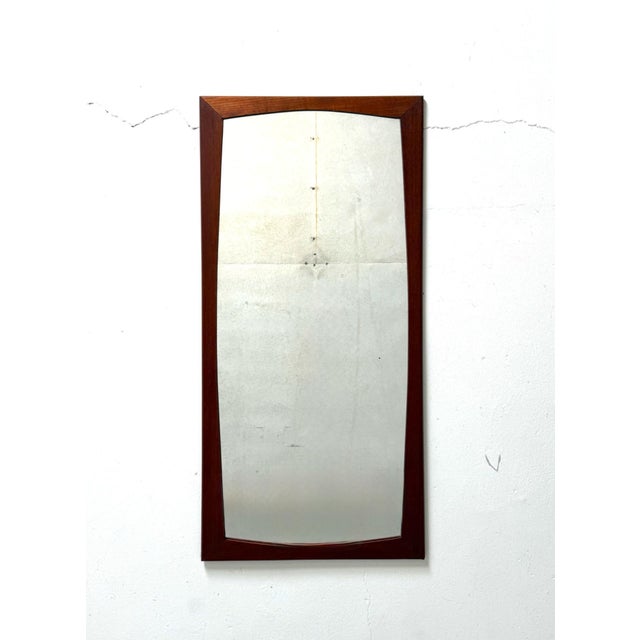 Teak Framed Mirror – Denmark, 1960s A refined Danish mirror from the 1960s featuring a warm teak frame and beautifully...