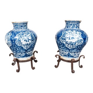 Pair of Mexican Talavera Poblana Pottery Blue and White Vases With Iron Stands For Sale