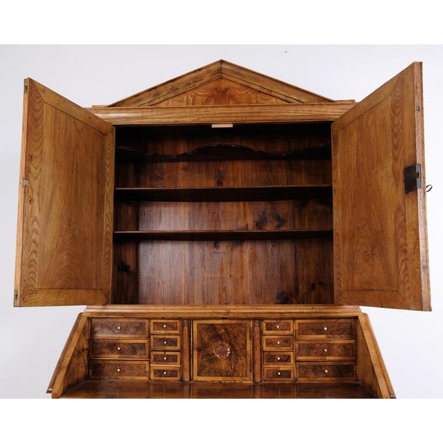 South jutland louis xvi bureau cabinet made of oak and dating from the 19th century. The upper section has a shaped top...