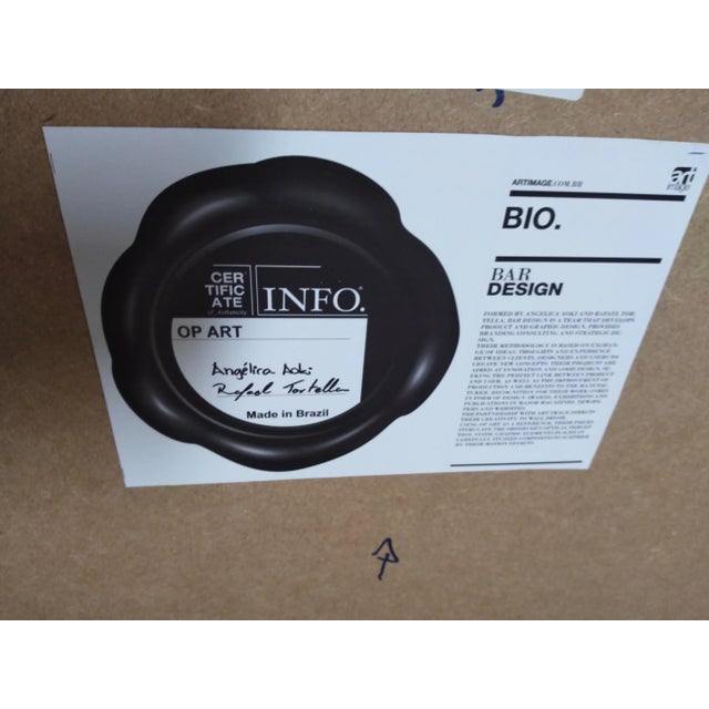 This piece is crafted by Angelica Aoki and Rafael Tortella for Bar Design. It's made of wood, sculptured to produce a wave...