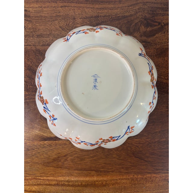 A beautifully hand-painted vintage porcelain charger by the renowned Japanese maker Fukagawa Seiji. This elegant scalloped...