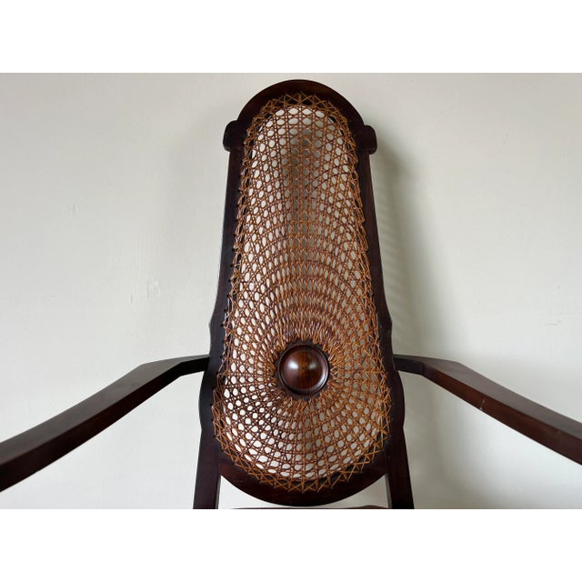 We are delighted to offer for sale this fantastic Vintage carved wood and cane accent chair. Features gorgeous tall - oval...