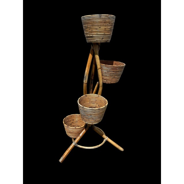 1950s rattan plant stand Good vintage condition Base of the first pot has been repaired.