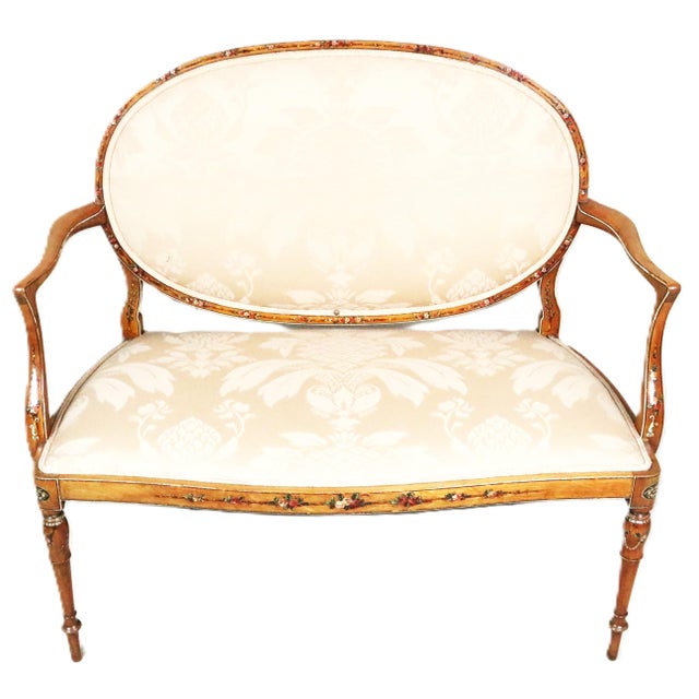 An English oval back settee from the Edwardian period as the beginning of the 20th century. It is made from mahogany and...