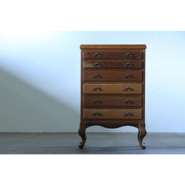This stunning vintage Danish oak cabinet/dresser is a masterpiece of mid-century craftsmanship, blending timeless design...