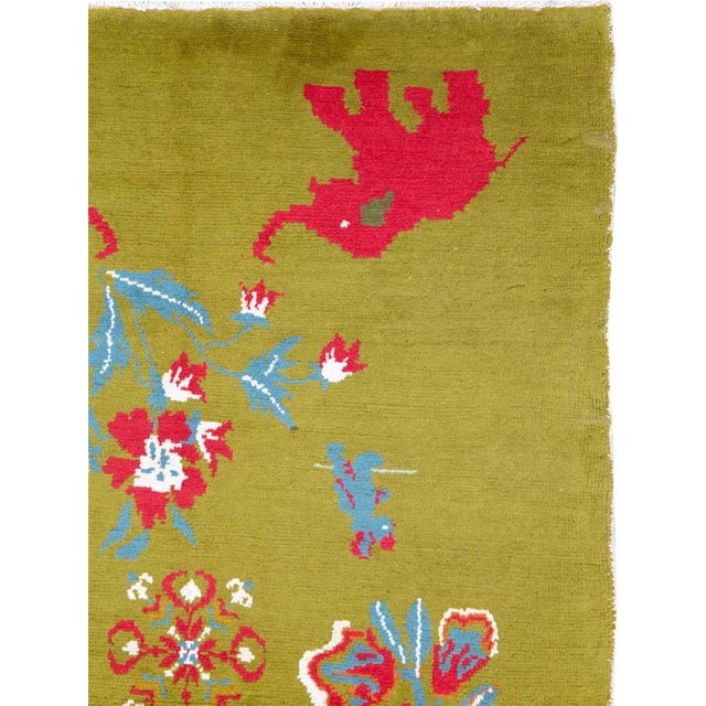 A vintage Swedish Pictorial rug handmade during the mid-20th century with saturated red elephants on the corners of the...