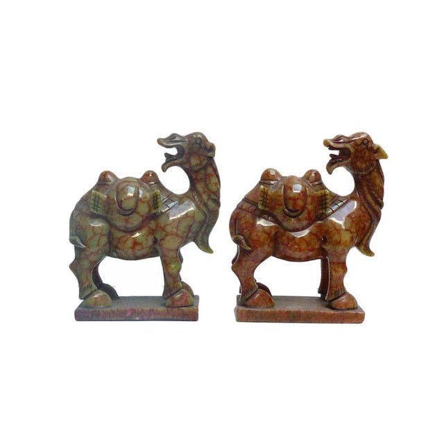 This simple detail fine quality camel figure is crafted by village artist with natural light green orange jade stone. it...