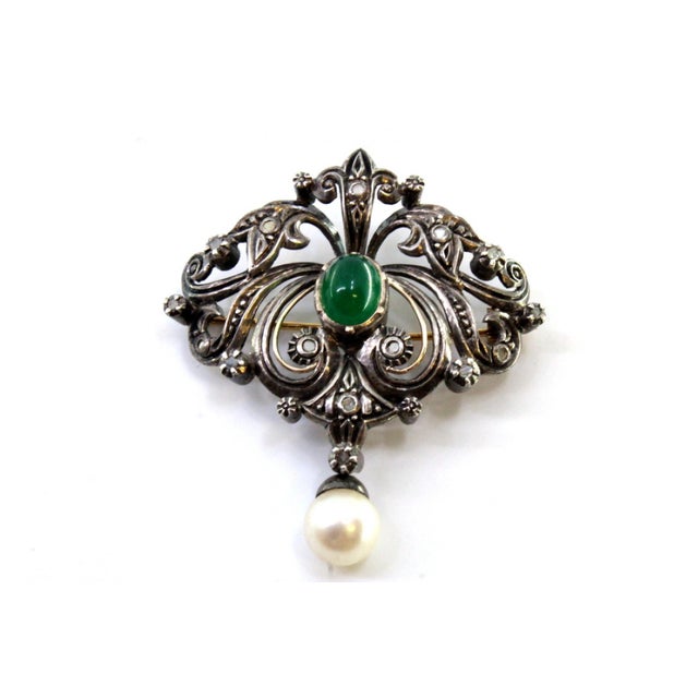 Gold and Silver Brooch with Diamond Chips, Faux Pearl and Central Synthetic Cabochon, in Very Good conditions. Designed...