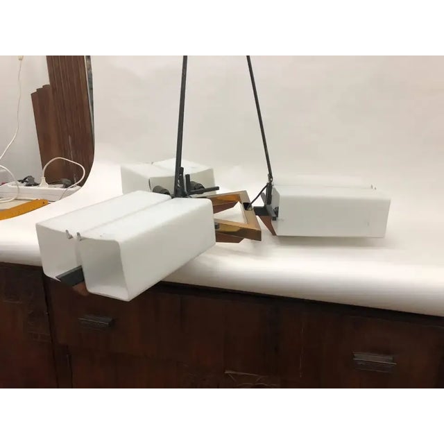 Stylish Mid-Century Modern chandelier in original patina with original squared white glasses, good conditions overall,...