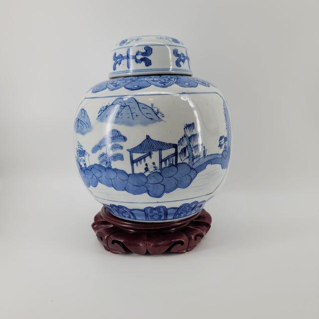 This classic mid-to-late 20th-century ovoid ginger jar is crafted from porcelain with traditional underglaze cobalt blue...