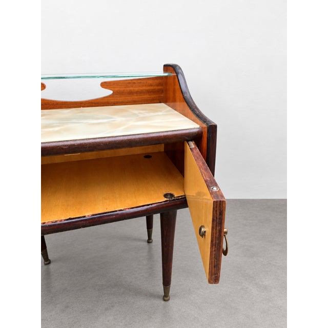 A splendid and authentic pair of Italian-made nightstands from the 1950s, in true Midcentury Modern style. The pieces...