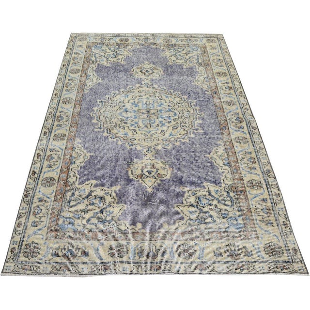 Hand-knotted with care using traditional rug-making techniques, this wool rug blends timeless craftsmanship with a modern...