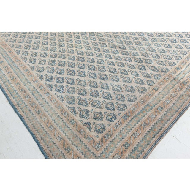 A breathtaking example of antique Indian textile artistry, this oversized Agra rug from the early 20th century exemplifies...