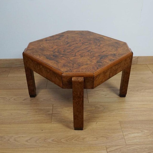 An Art Deco burr walnut veneered coffee table. Dimensions: H 39cm W 59cm D 59cm Origin: English Date: Circa 1935