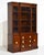 Striking, elegant and beautifully crafted, this Mid Century Traditional Style Mahogany Display Curio China Cabinet by RWay...