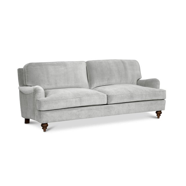Timeless style meets luxurious comfort in this high-end English Roll Arm sofa. Upholstered in 100% cotton velvet with a...