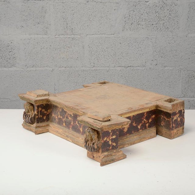 This antique carved wooden altar base is a fascinating example of Baroque-era sacred art. The structure, designed to...