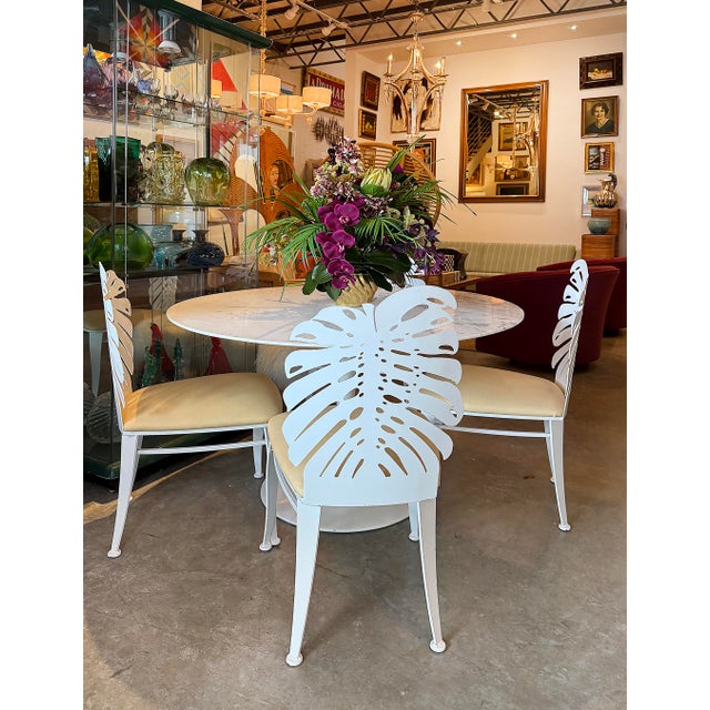 Vintage Painted Cut Iron Monstera Leaf Chairs with Cushions, Set of 4 Offered for sale is a substantial and striking set...