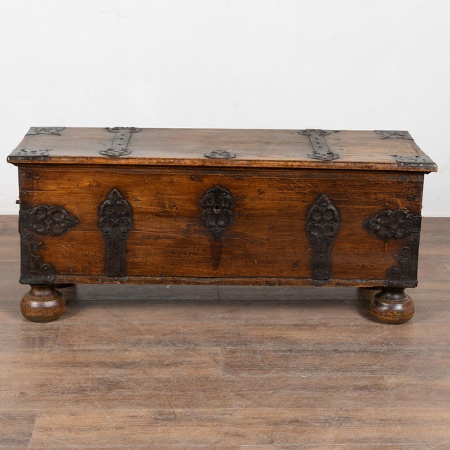 It is the incredible hand-wrought iron details that make this flat-top trunk an exceptional find. Note the iron hinges,...