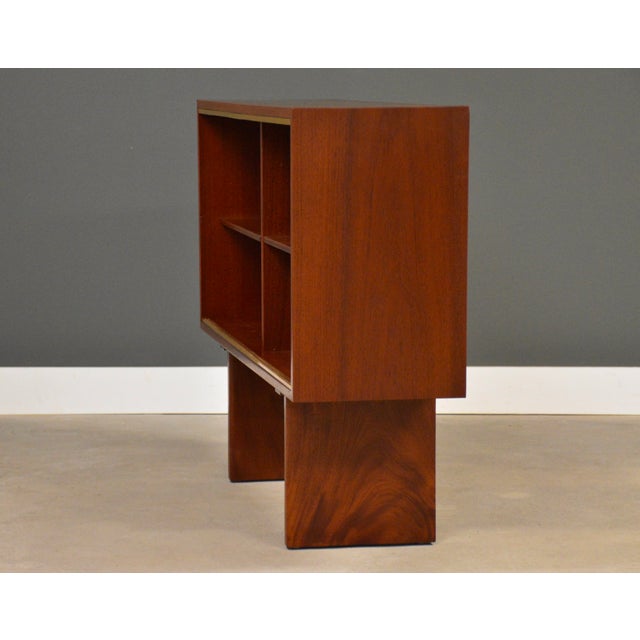 A mid century modern teak bookcase with adjustable shelves and brass accents. Professionally refinished. Made in Denmark....