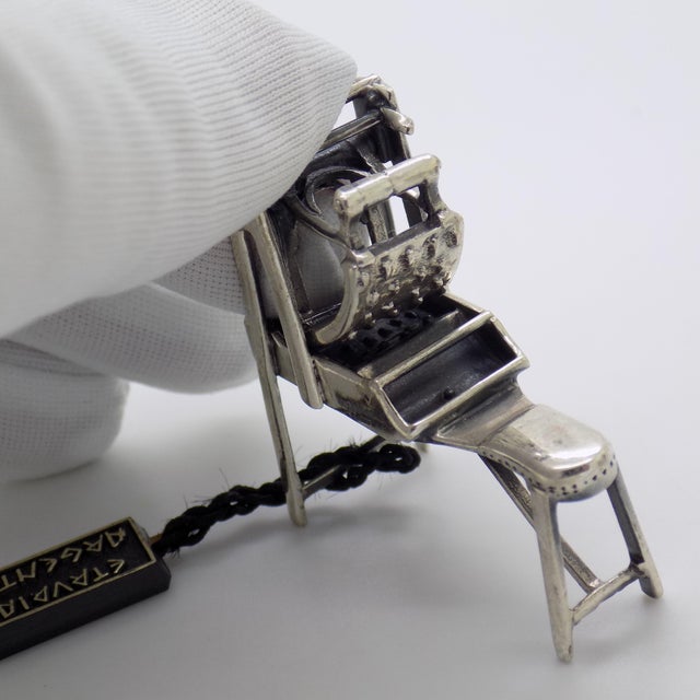 A wonderfully unusual and highly collectible piece, this vintage Italian miniature depicts a bread roll making machine,...