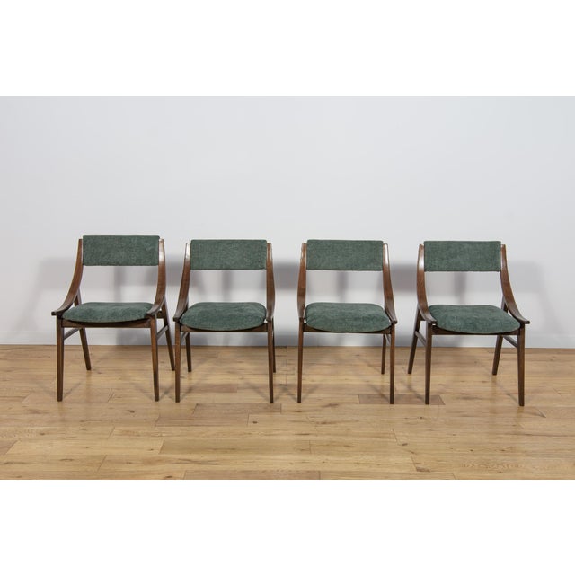 This set of four dining chairs was produced by Zamojska Furniture Factory in Poland circa 1970. It was designed by Juliusz...