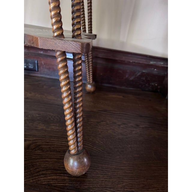 Folk art style end table in medium brown finish.