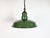 Industrial green enamel factory pendant light made in United Kingdom during the 1960s. White enamel inside the shade....