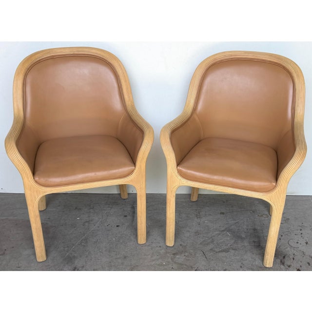 Pair of Karl Rausch for Baker "Linea Cara" Split-Reed Rattan & Leather Armchairs, Circa 1970s This pair of Karl Rausch for...
