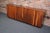 American Modern custom-made walnut credenza/cabinet in walnut supported by an ebonized plinth base (ca. 1960s/70s)....