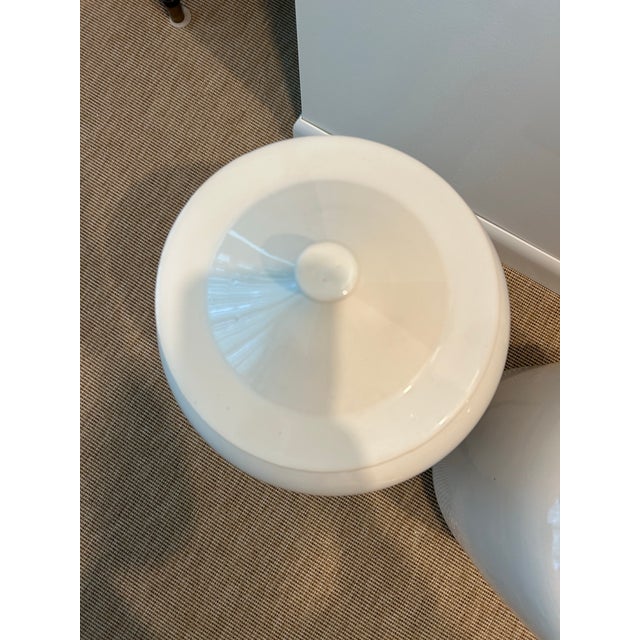 Large scale ceramic urn with lid. These are perfect for a traditional or modern decor. There is a small chip under one lid...