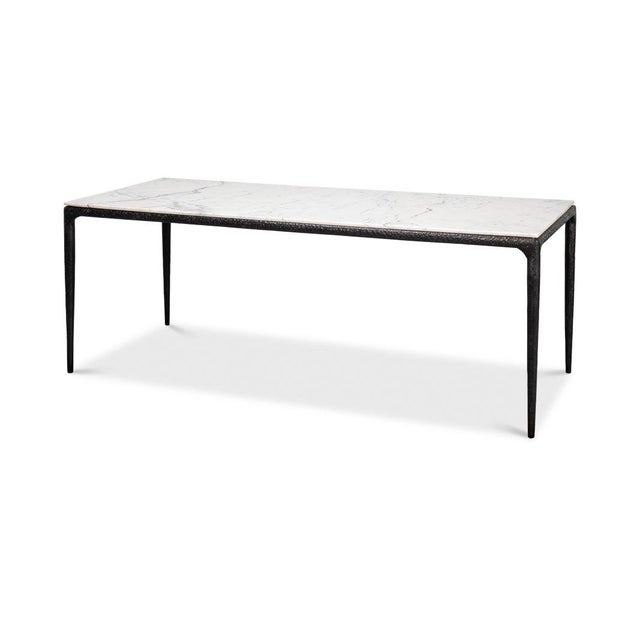 This piece features a stunning white marble top, each slab showcasing natural, unique veining. The hand-wrought iron legs...