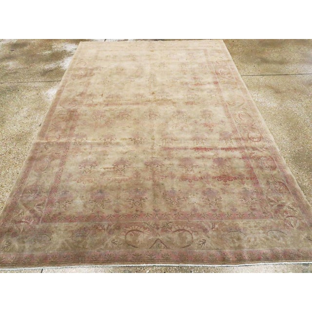 An antique Indian Lahore accent rug handmade during the Early 20th century. Measures: 6' 3" x 9' 7"