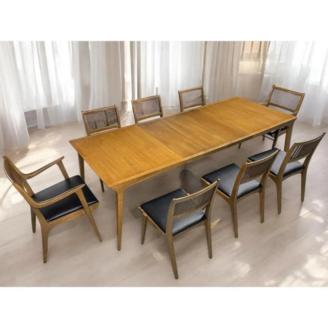 Huge 98" long John Van Koert for Drexel Profile walnut and pecan Model K44 Extending Dining Table, circa 1950s. The...