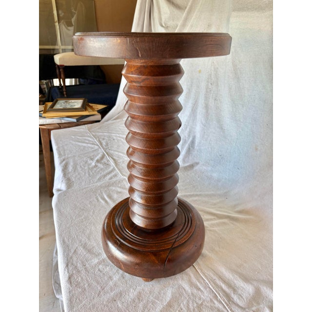 Found in the South of France, this 20th Century French Walnut Pedestal Side Table in the Style of Charles Dudouyt dates...