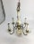 This is a beautiful old chandelier with lovely floral detail and brass accents was obtained at a turn of the century home...
