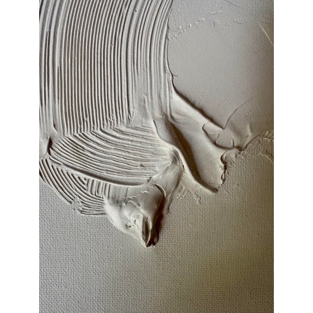 11” by 14” abstract white plaster on board by artist Angela Allen. Unframed.