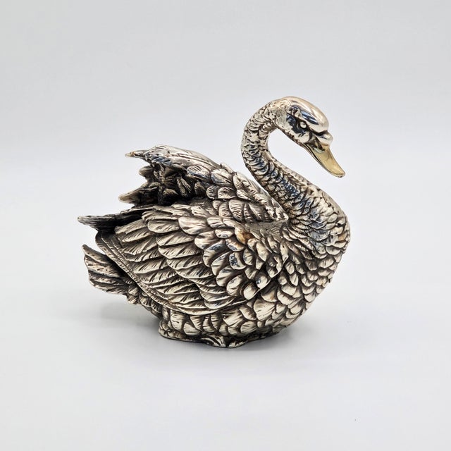 A vintage D’Argenta silver-plated swan sculpture, handcrafted in Mexico City. The piece features a graceful curved neck,...