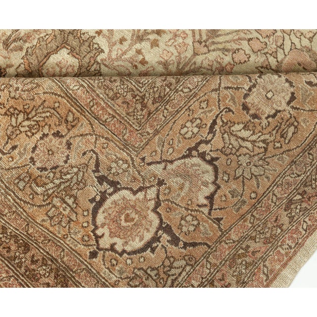 A fine example from our collection of early 20th century Northwest Persian rugs, the beige field with a design of...