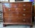Stunning 19th century 5-drawer Georgian chest of drawers crafted of mahogany and featuring decorative brass pulls. 43"w x...