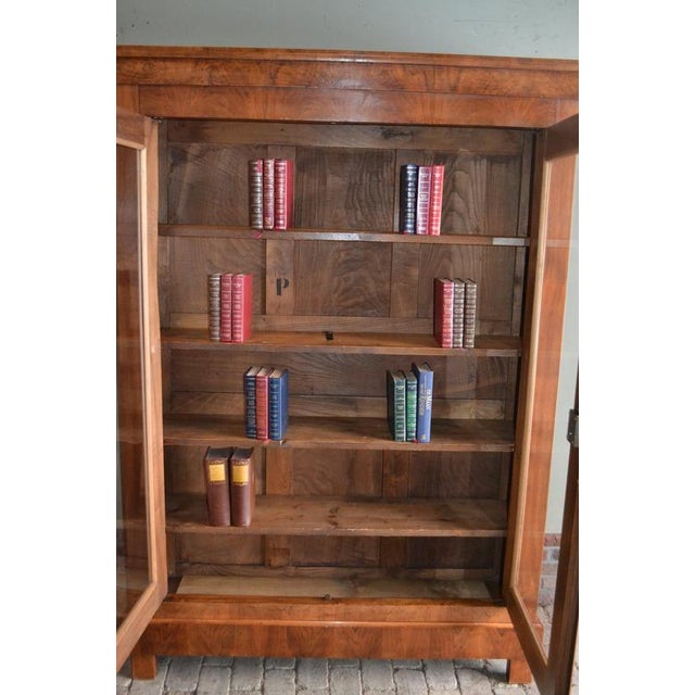 19th-century French cherrywood bookcase, display cabinet, shop cabinet, china cabinet, or library cabinet. The height is...