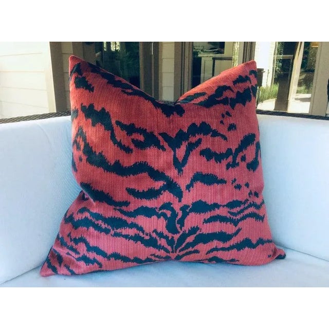 A striking pair of pillows in plush red "Le Tigre" fabric by Scalamandre. It features decadent silk velvet stripes in...